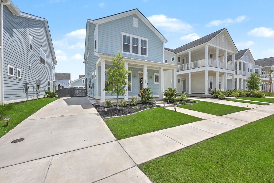Front exterior of a new home in Carnes Crossroads, Summerville, SC, highlighting curb appeal (Image 26).