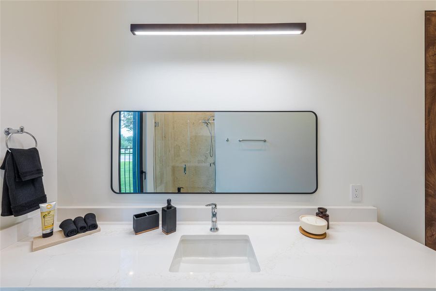 Modern bath with spacious vanity and sleek fixtures.