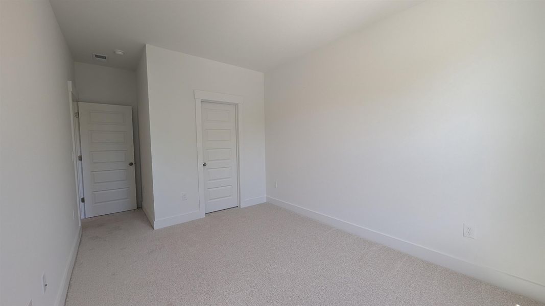 Spacious, unfurnished interior of a new home in Long Bay Golf Club, Longs (Image 34).
