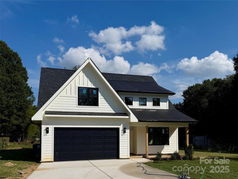 Front exterior of a new home in , Mooresville, NC, highlighting curb appeal (Image 2).