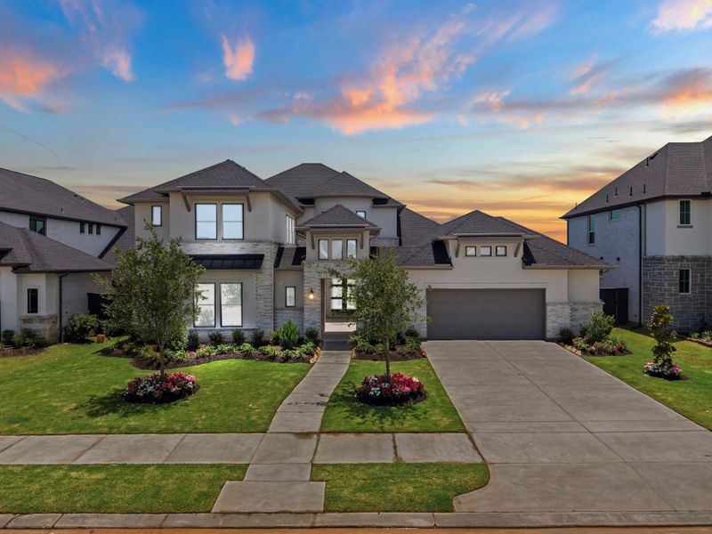 Front exterior of a new home in Harvest Green, Richmond, TX, highlighting curb appeal (Image 22). Front exterior of a new home in Harvest Green, Richmond, TX, highlighting curb appeal (Image 22).