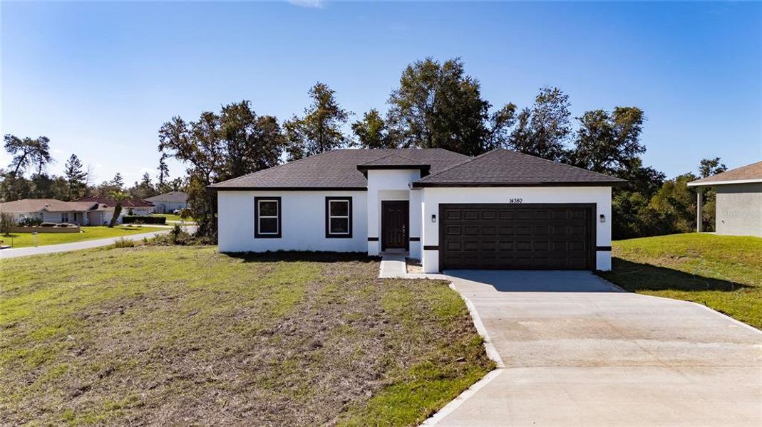 Front exterior of a new home in , Ocala, FL, highlighting curb appeal (Image 1). Front exterior of a new home in , Ocala, FL, highlighting curb appeal (Image 1).