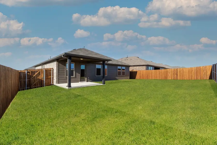 Exterior details and patio area of a home in Lake Pointe, Little Elm (Image 2). Exterior details and patio area of a home in Lake Pointe, Little Elm (Image 2).