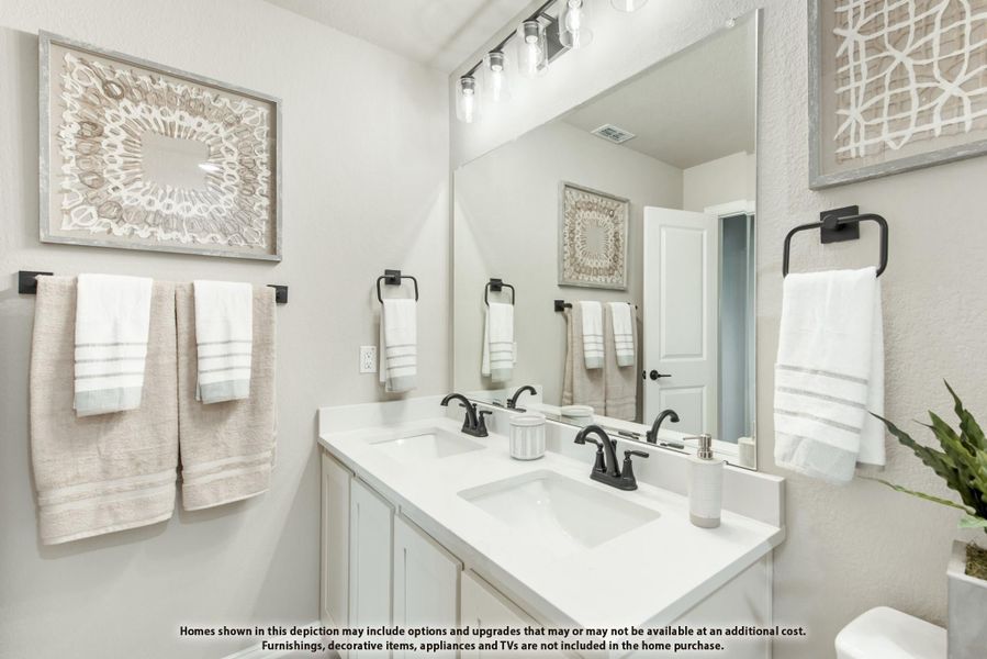 Bathroom with double sink vanity, white countertop, large mirror, and black fixtures Bathroom with double sink vanity, white countertop, large mirror, and black fixtures