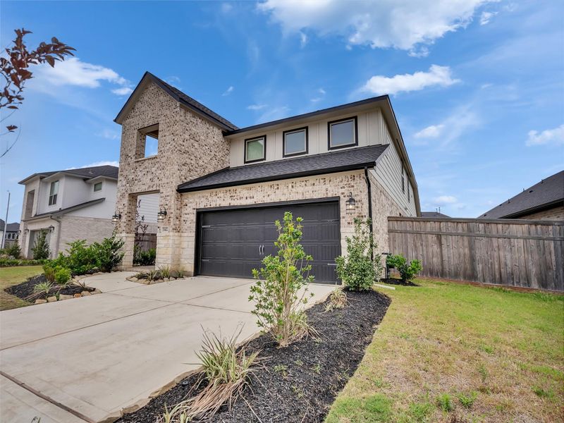 Front exterior of a new home in Cross Creek West, Fulshear, TX, highlighting curb appeal (Image 23).