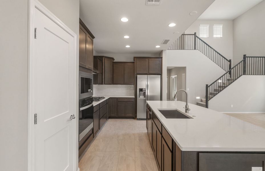 Representative furnished interior of a home built from the Yucca by Pulte Homes in Parkside at Anthem at Merrill Ranch, Florence (Image 11).