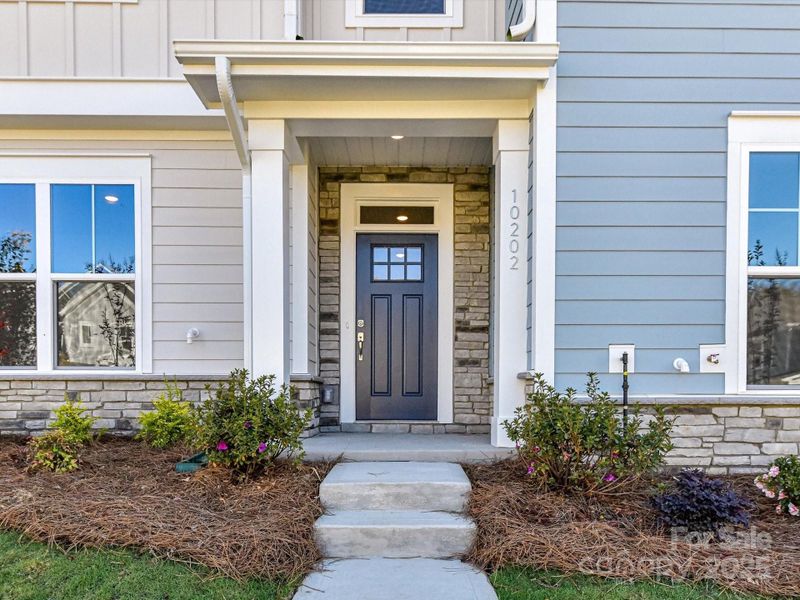 Exterior details and patio area of a home in North Creek Village - Townhomes, Huntersville (Image 3).