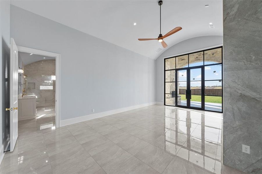 Unfurnished room featuring lofted ceiling, recessed lighting, and a ceiling fan Unfurnished room featuring lofted ceiling, recessed lighting, and a ceiling fan