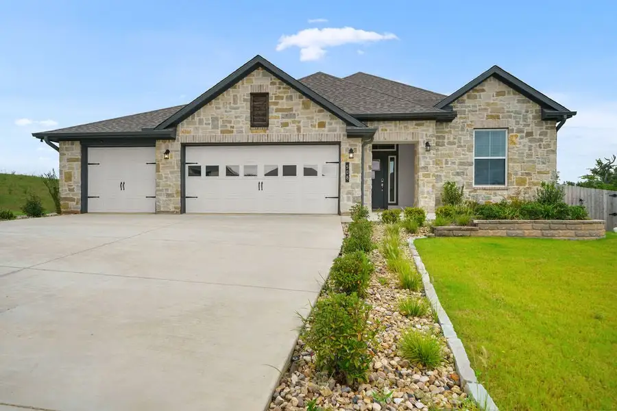 Front exterior of a new home in Wellington Place, Tyler, TX, highlighting curb appeal (Image 1). Front exterior of a new home in Wellington Place, Tyler, TX, highlighting curb appeal (Image 1).