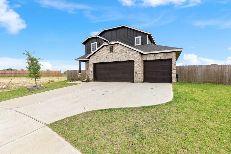 Front exterior of a new home in Sweetgrass Village, Crosby, TX, highlighting curb appeal (Image 26).