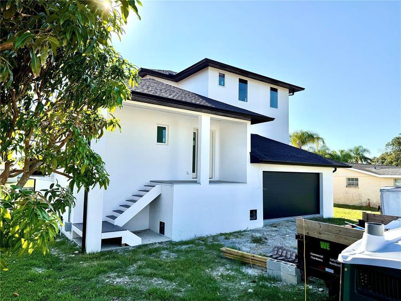 Front exterior of a new home in , Port Richey, FL, highlighting curb appeal (Image 1).