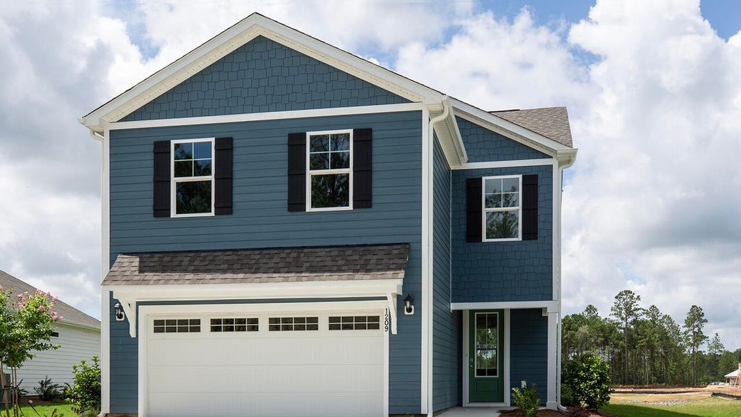 Front exterior of a new home in Indigo Preserve, Leland, NC, highlighting curb appeal (Image 1).
