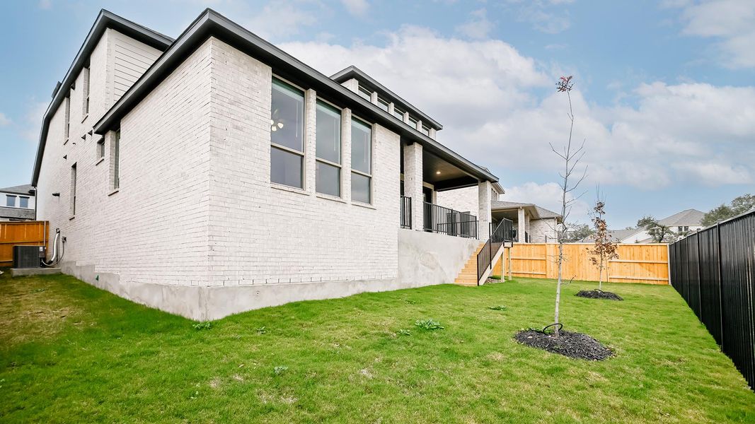 Exterior details and patio area of a home in 6 Creeks 50', Kyle (Image 15).
