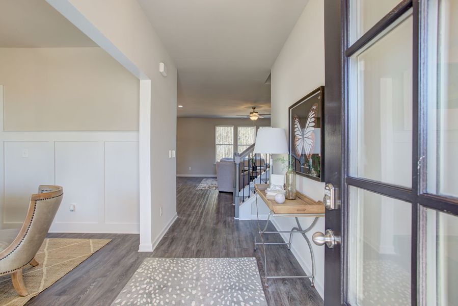 The foyer leads to the open-concept kitchen, family room, and dining spaces