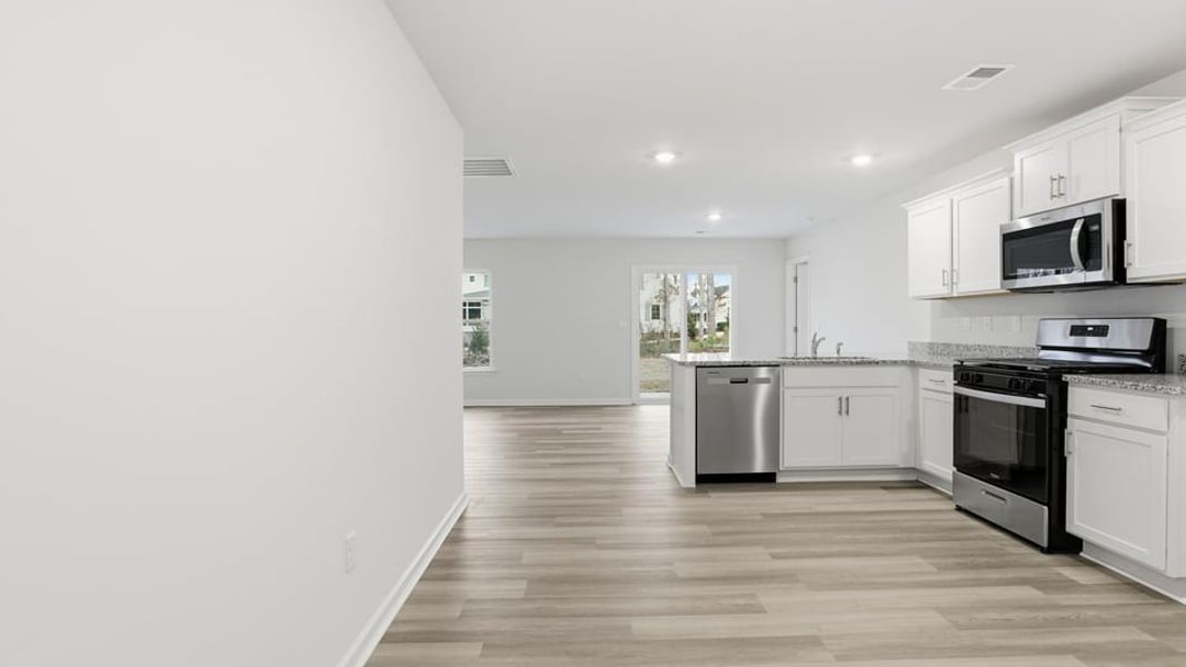 Furnished interior view inside a new home in Bentley Park, Greenwood (Image 4).