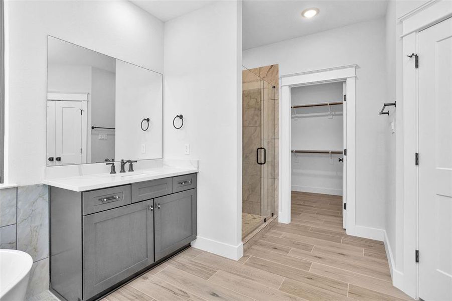 View of separate shower and closet