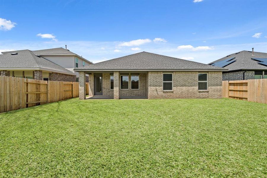 Front exterior of a new home in Sunterra, Katy, TX, highlighting curb appeal (Image 12).