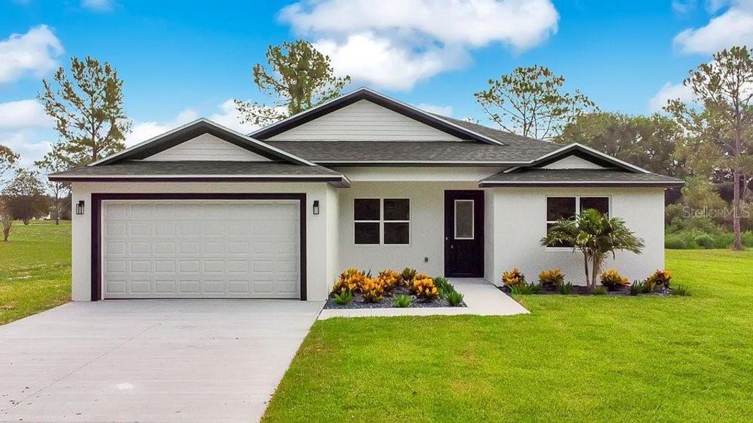Front exterior of a new home in , Lady Lake, FL, highlighting curb appeal (Image 2). Front exterior of a new home in , Lady Lake, FL, highlighting curb appeal (Image 2).