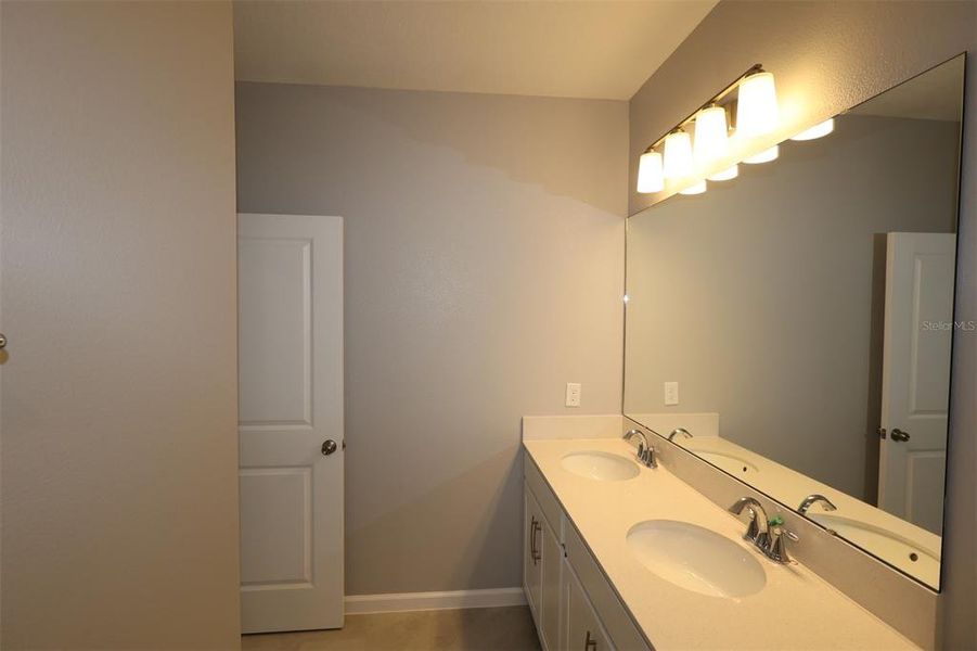 Furnished interior view inside a new home in Center Lake on the Park, St. Cloud (Image 11).