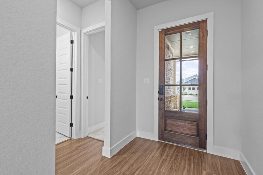 A room with a door and a window. A room with a door and a window.