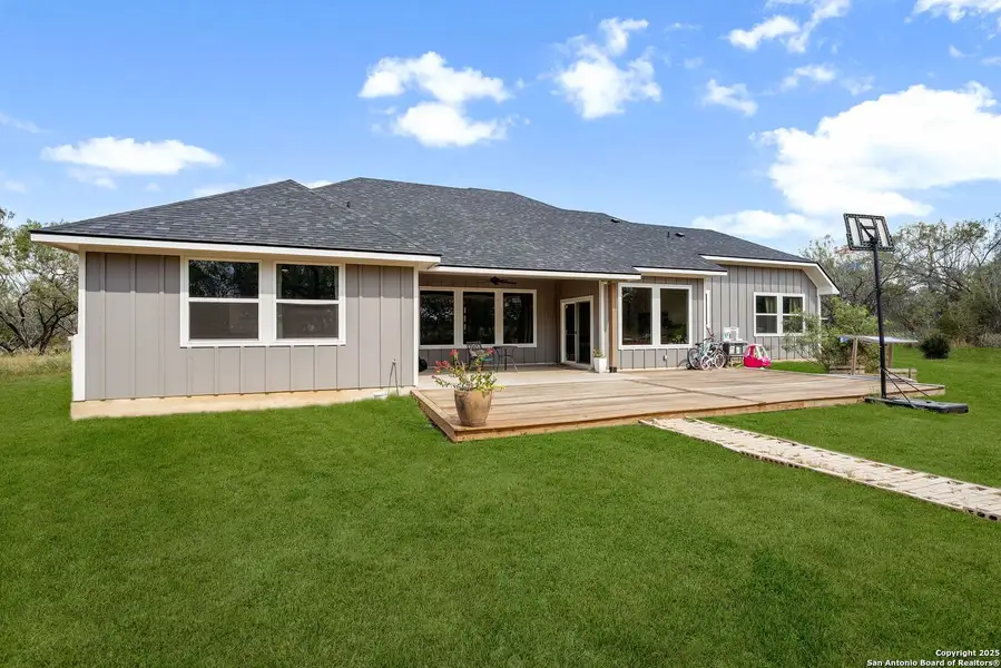 Exterior details and patio area of a home in , Devine (Image 18).