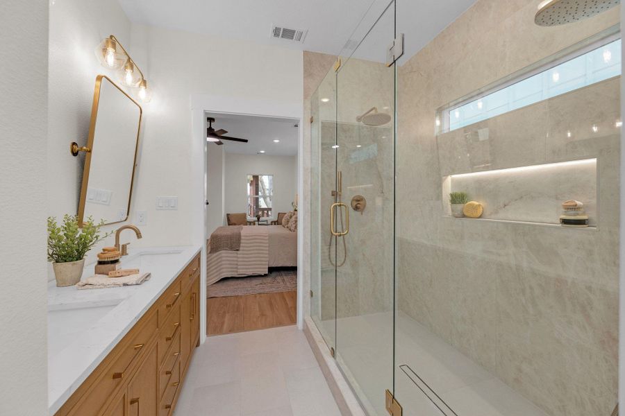 Ensuite bathroom featuring double vanity, double stall shower, with LED niche lighting