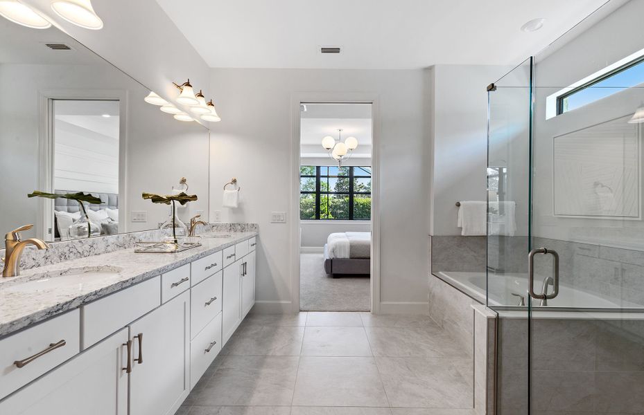 Owner's bathroom with dual sinks and optional garden tub