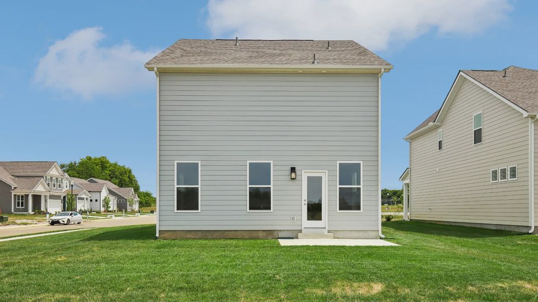Large Backyard of home with small back patio Large Backyard of home with small back patio