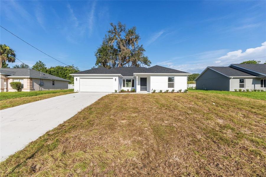 Front exterior of a new home in , Ocala, FL, highlighting curb appeal (Image 29).