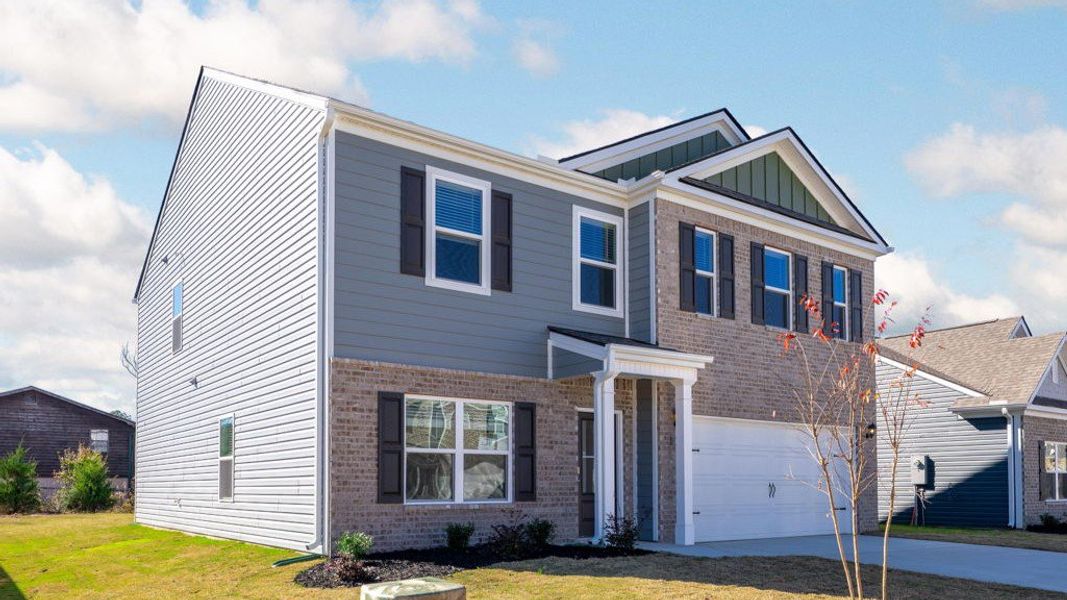 Front exterior of a new home in Hillcrest Landing, McDonald, TN, highlighting curb appeal (Image 20).