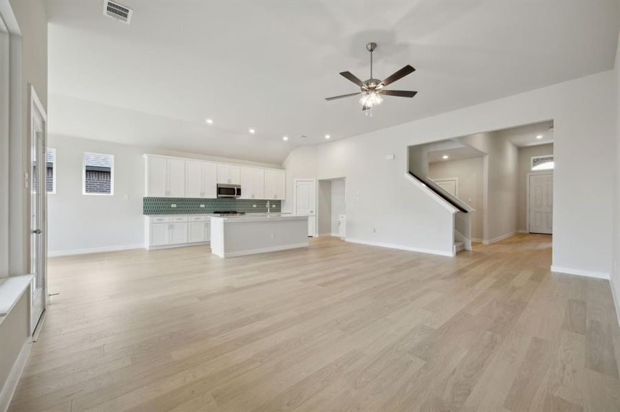 Looking towards the front of the home and you can see the stairs and front entry