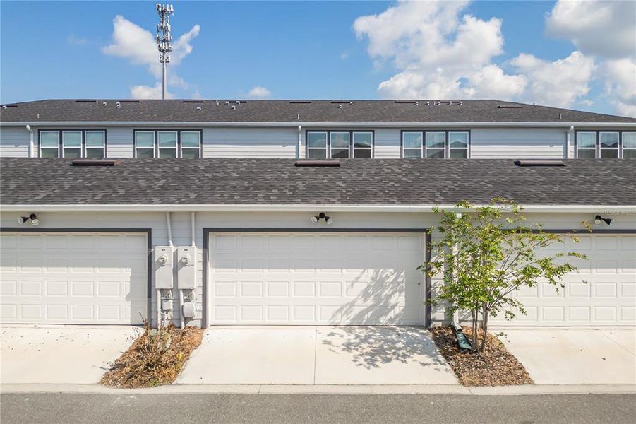 Front exterior of a new home in , Orlando, FL, highlighting curb appeal (Image 27).