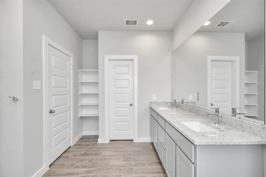 Another view of the primary bath. Sample photo of completed home with similar floor plan. As-built interior colors and selections may vary.