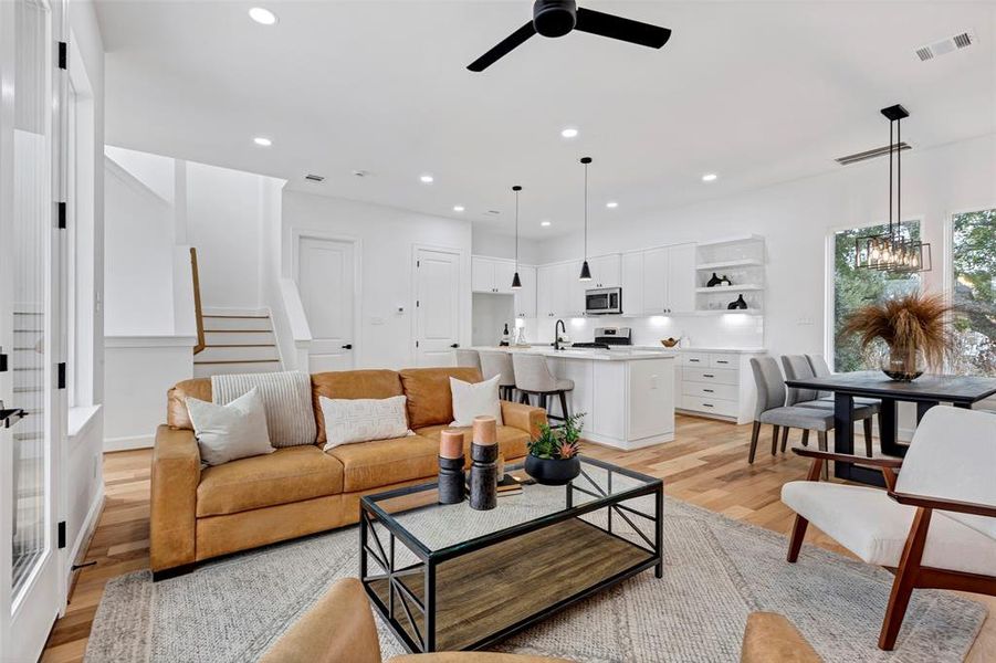 A view of the main living space. The kitchen, dining, and living spaces flow together well. (Model Unit 9424C)