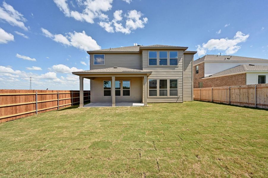 Front exterior of a new home in Salerno - Classic Collection, Round Rock, TX, highlighting curb appeal (Image 19). Front exterior of a new home in Salerno - Classic Collection, Round Rock, TX, highlighting curb appeal (Image 19).