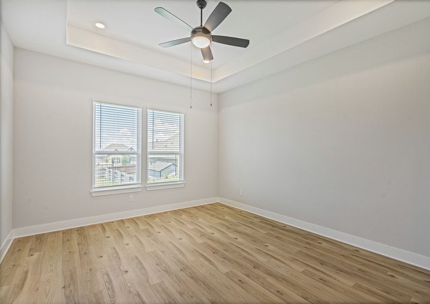 The master bedroom has two large windows that let in great, natural light.