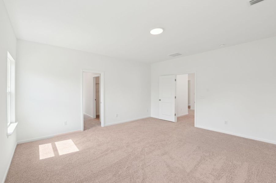 Representative unfurnished interior of a home built from the Alexis by Ashton Woods in Rowland's Grant, Fuquay Varina (Image 34).