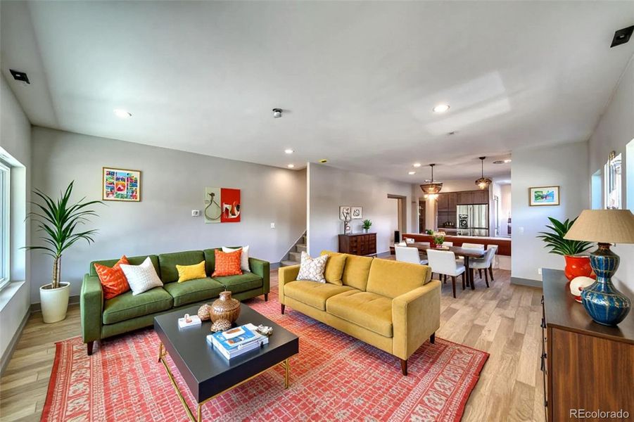 Virtually staged living room and dining room.