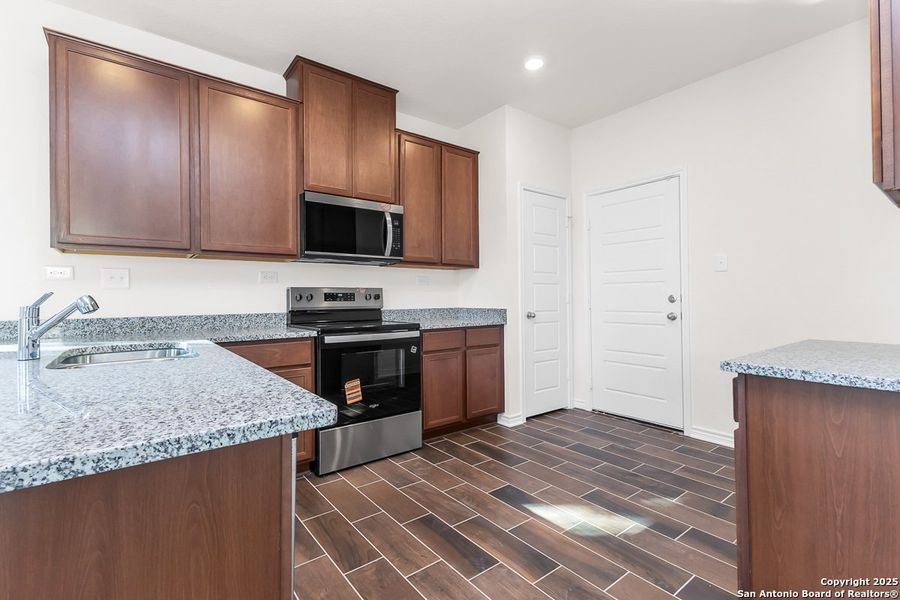 Furnished interior view inside a new home in Spanish Trails Villas, San Antonio (Image 4).