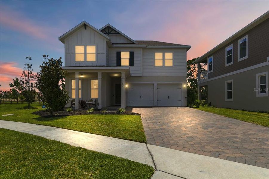 Front exterior of a new home in , Winter Garden, FL, highlighting curb appeal (Image 1). Front exterior of a new home in , Winter Garden, FL, highlighting curb appeal (Image 1).