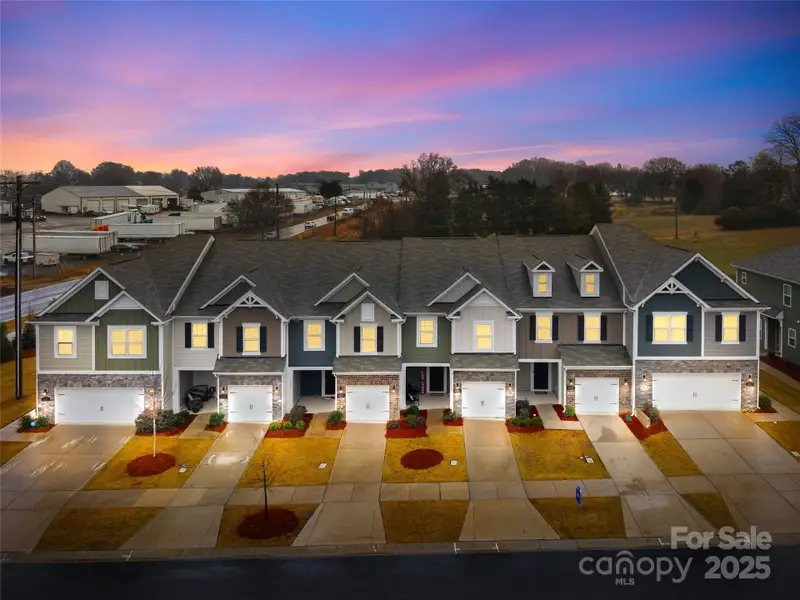 Front exterior of a new home in Secrest Landing, Monroe, NC, highlighting curb appeal (Image 2). Front exterior of a new home in Secrest Landing, Monroe, NC, highlighting curb appeal (Image 2).