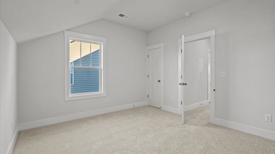 First-class bedroom with generous proportions, a walk-in closet, and beautiful natural light through large windows