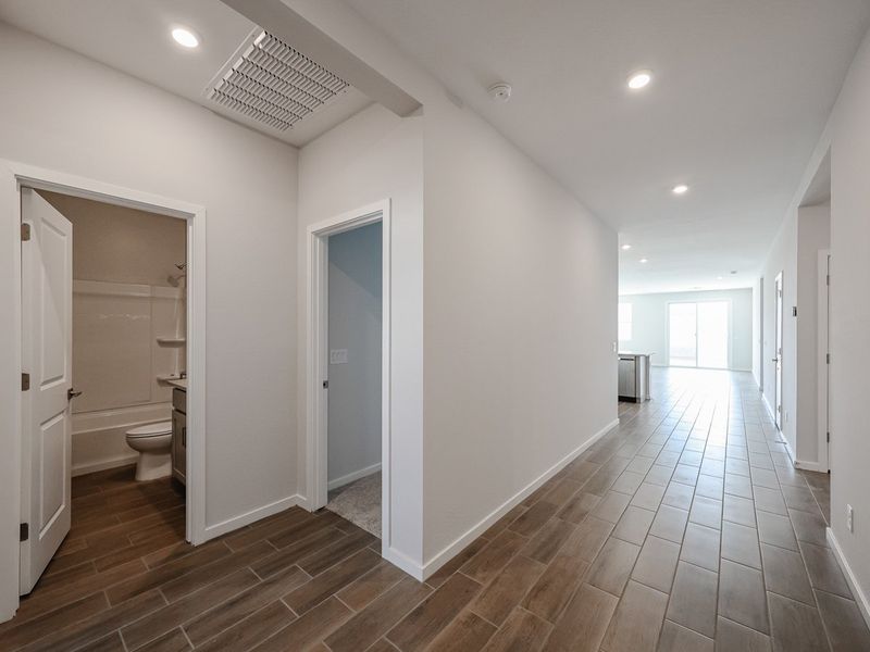 A bathroom with white walls.