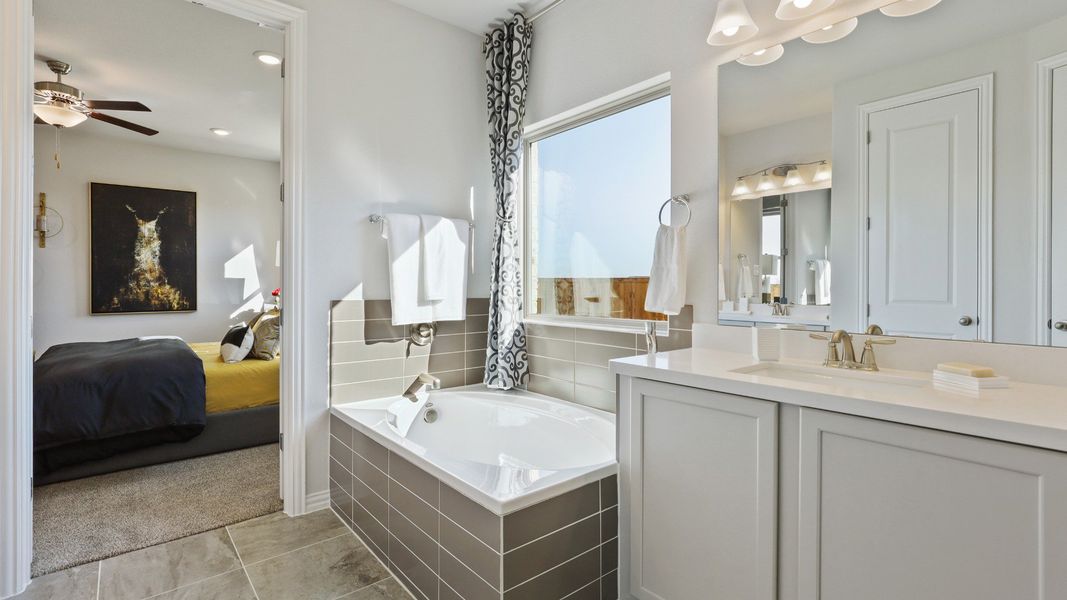 Representative furnished interior of a home built from the Hickory by Brightland Homes in Sunterra, Katy (Image 9).