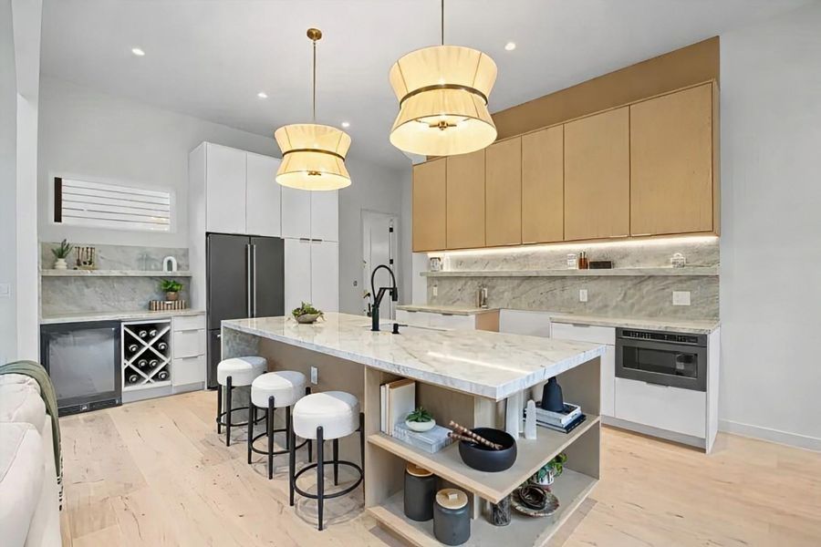 Kitchen with open shelves, hanging light fixtures, backsplash, high end refrigerator, and recessed lighting