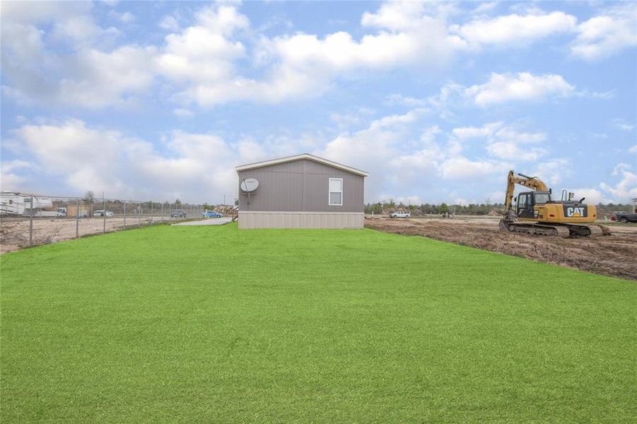 View of Home and Property from back yard.Green Sod was added to display beauty potential.