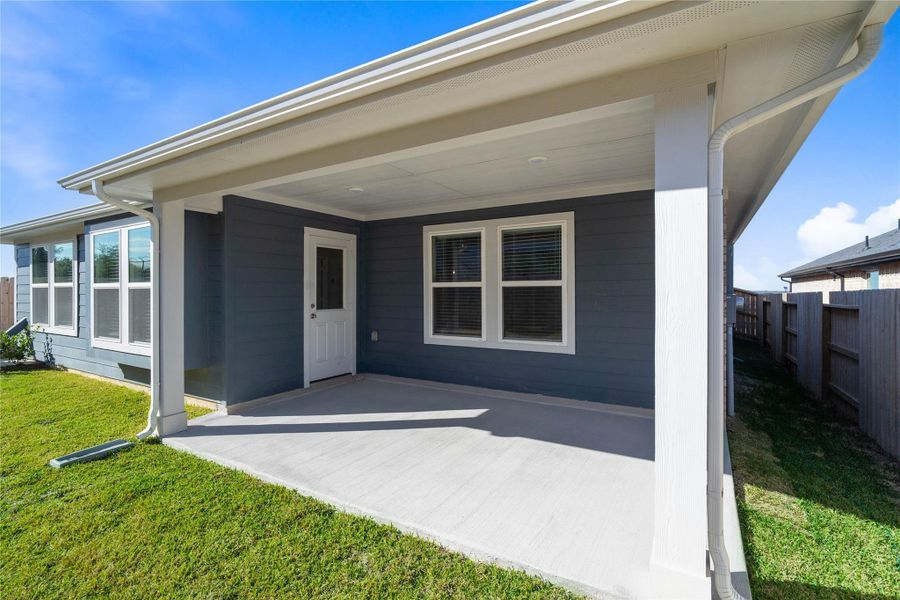 The spacious covered patio offers a tranquil outdoor retreat, perfectly designed for savoring your quiet morning coffee or unwinding during peaceful evening relaxation. The spacious covered patio offers a tranquil outdoor retreat, perfectly designed for savoring your quiet morning coffee or unwinding during peaceful evening relaxation.