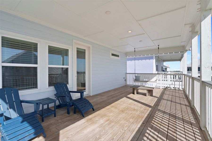 Another glimpse of the private back porch reveals its quiet elegance—where rich wood textures, soft sunlight, and the seamless connection to the primary suite create a serene, everyday escape. From your morning coffee to evening reflections, this peaceful nook offers pure comfort and style. Another glimpse of the private back porch reveals its quiet elegance—where rich wood textures, soft sunlight, and the seamless connection to the primary suite create a serene, everyday escape. From your morning coffee to evening reflections, this peaceful nook offers pure comfort and style.