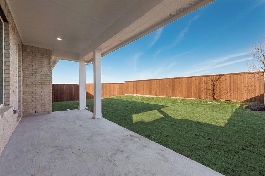 Exterior details and patio area of a home in Wildflower Ranch, Justin (Image 3).