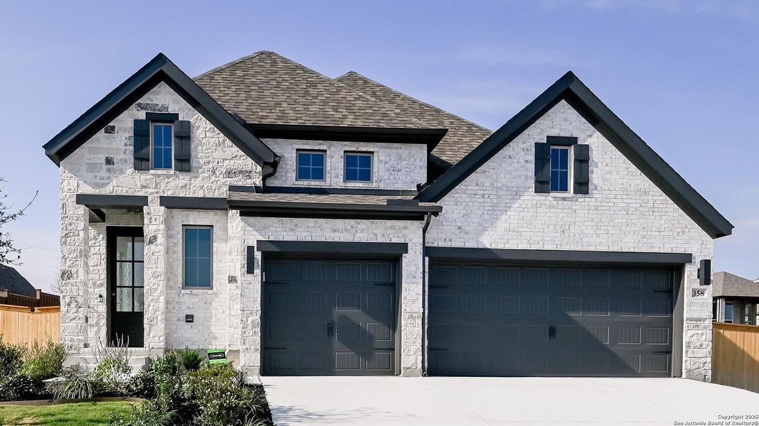 Front exterior of a new home in Mayfair 50', New Braunfels, TX, highlighting curb appeal (Image 2). Front exterior of a new home in Mayfair 50', New Braunfels, TX, highlighting curb appeal (Image 2).